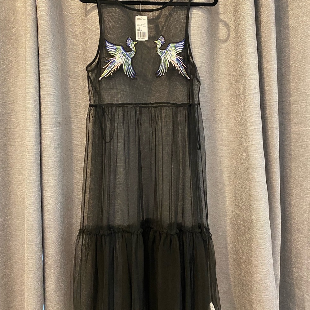 Bathing suit cover up or over top. Never worn